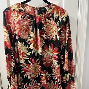 Fun blouse with the coolest cuff and button sleeves.